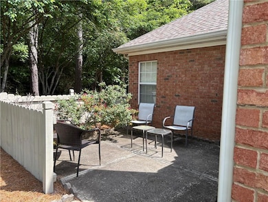 View of patio / courtyard featuring a privacy fenc