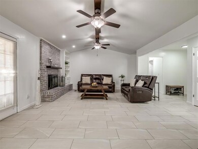 Tiled living room with built in shelves, ceiling f