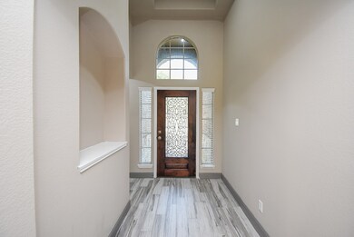 Welcoming entryway featuring elegant tile flooring