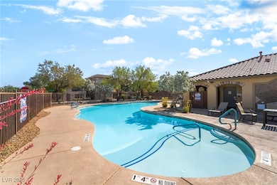 Community pool with a patio area