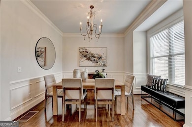 Formal Dining Room with custom trim and hardwoods.