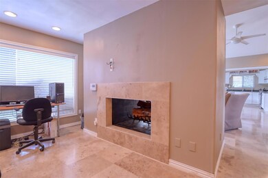 Den/office with a see through fireplace