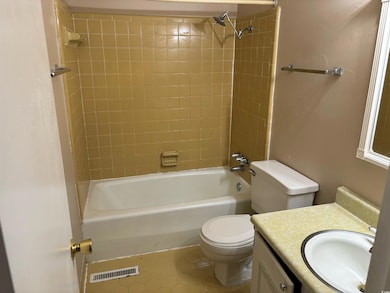 Full bathroom with toilet, tiled shower / bath, va