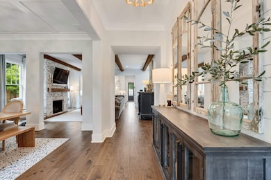 Corridor with dark wood finished floors and baseboards