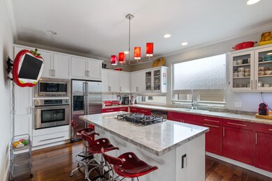 Inviting kitchen with excellent storage, large isl