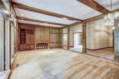 The homes primary living space has stunning wood w