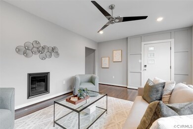 The formal living room has a gas fireplace, excell