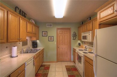 The kitchen offers an abundant amount of upper and