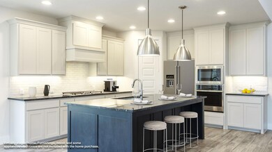Kitchen with stainless steel appliances, a sink, 