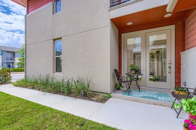 Property entrance featuring stucco siding
