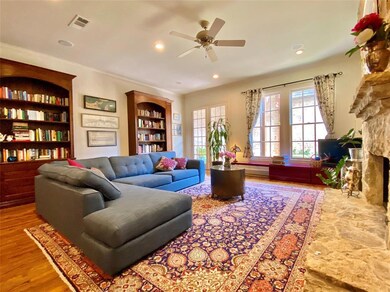 Large family room with custom built bookcases that