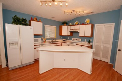 Open kitchen with all the appliances including the