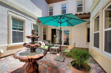 Private courtyard with fountain & pavers.