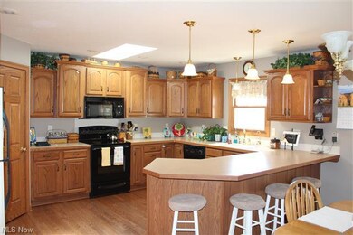 Large kitchen has been just freshly painted.  Feat