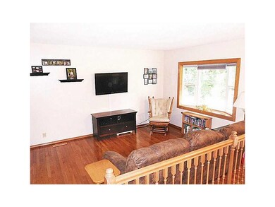 Family Room. Shining hardwood floors and a bay win