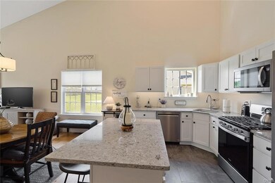 Kitchen with island extra wide dining space added.