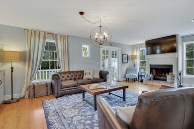 living room with wood burning fireplace