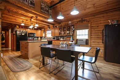 Spacious eat-in kitchen has beautiful cabinetry an