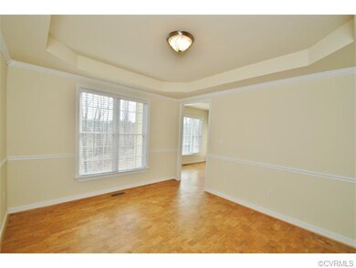 Tray ceiling, crown moulding and chair railing in 