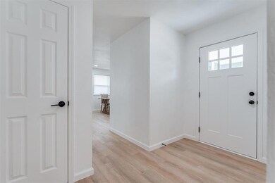 Foyer entrance featuring light wood finished floor