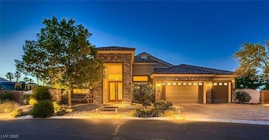Prairie-style home with stone siding, a garage, a