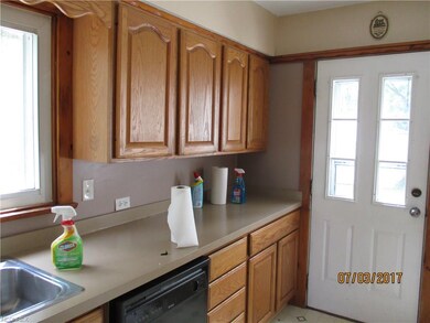 The kitchen is open, bright and has access to the 