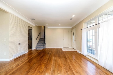 Canned lights and built-in speakers enhance your living room area.
