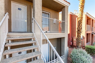 Doorway to property featuring stucco siding