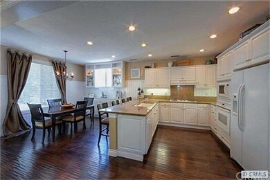 Rich hardwood floors extend throughout the ground 