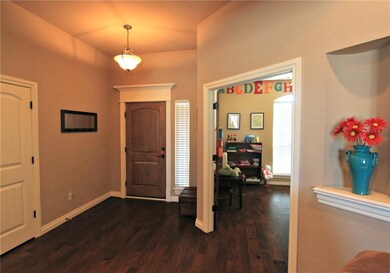 Entrance has Wood Flooring with French Doors leadi