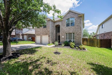 Traditional home featuring driveway, an attached 