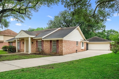 Extra long driveway that leads to a 2 car garage.