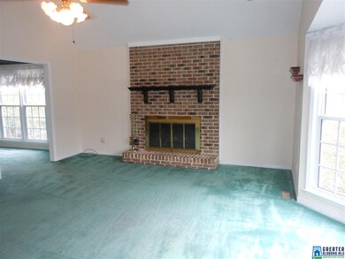 Great Room has vaulted ceiling and brick fireplace