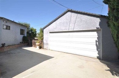 This garage is extra wide and extra deep - there is a long workbench on the west side and a huge workshop area in the rear of the garage.