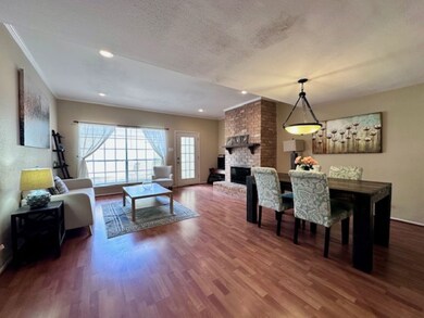 Living and dining rooms with patio access.