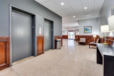 Hallway featuring recessed lighting, elevator, li