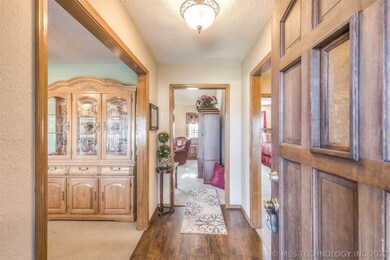 The front entry leads to the dining are and kitche