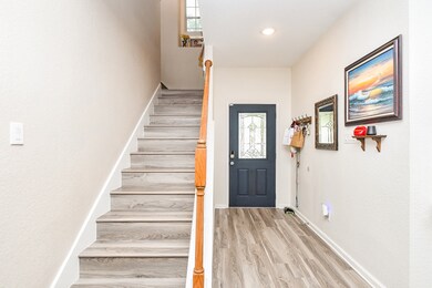 Bright entryway with the staircase leading upstair