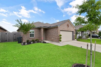This home offers beautiful curb appeal including classic brick elevation, manicured landscape, and a green front lawn with maturing trees.