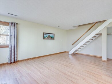 Staircase leading to the upstairs bedrooms and bat