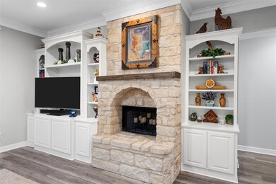 Living room featuring ornamental molding, baseboar