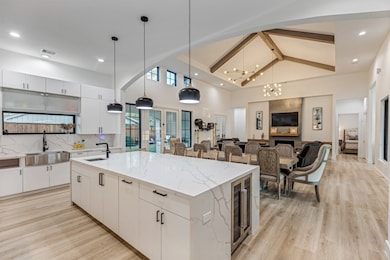 This open-concept living space features a modern k