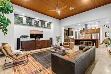 Living room featuring a ceiling fan, light tile patterned floors, recessed lighting, wooden ceiling, and stairway