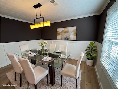 Formal dining room will accommodate a table for 8 - 10   people