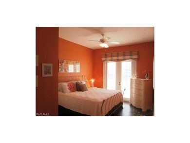 2nd Bedroom with Espresso colored wood floors. You