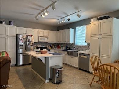 Kitchen featuring appliances with stainless steel