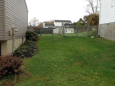 Exterior Front. Side yard to back.