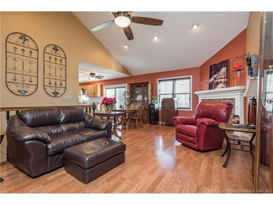This spacious living room features a vaulted ceili