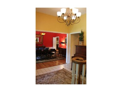The tile entry way has two coat closets and provid