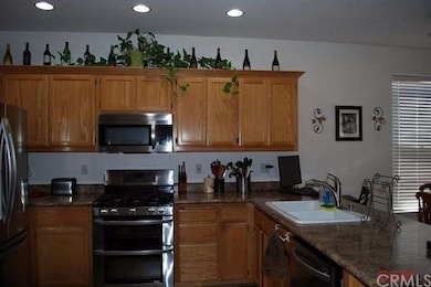 Solid Oak cabinetry compliment the new stainless s
